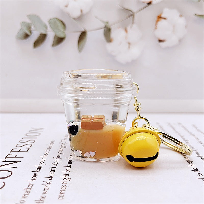 Comercio al por mayor acrílico flotando en el aceite de chocolate arenas movedizas llavero creativo